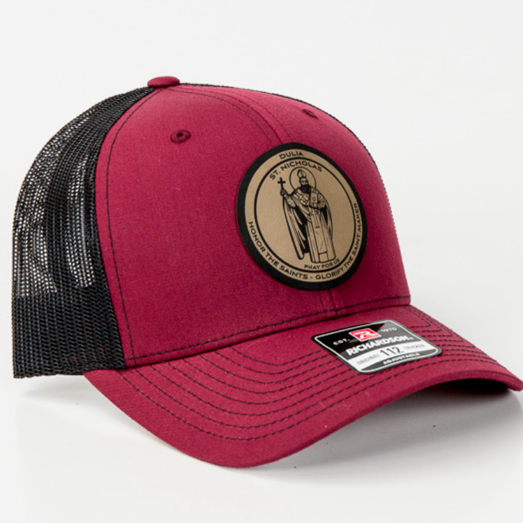 Leather patch trucker hat with St Anthony