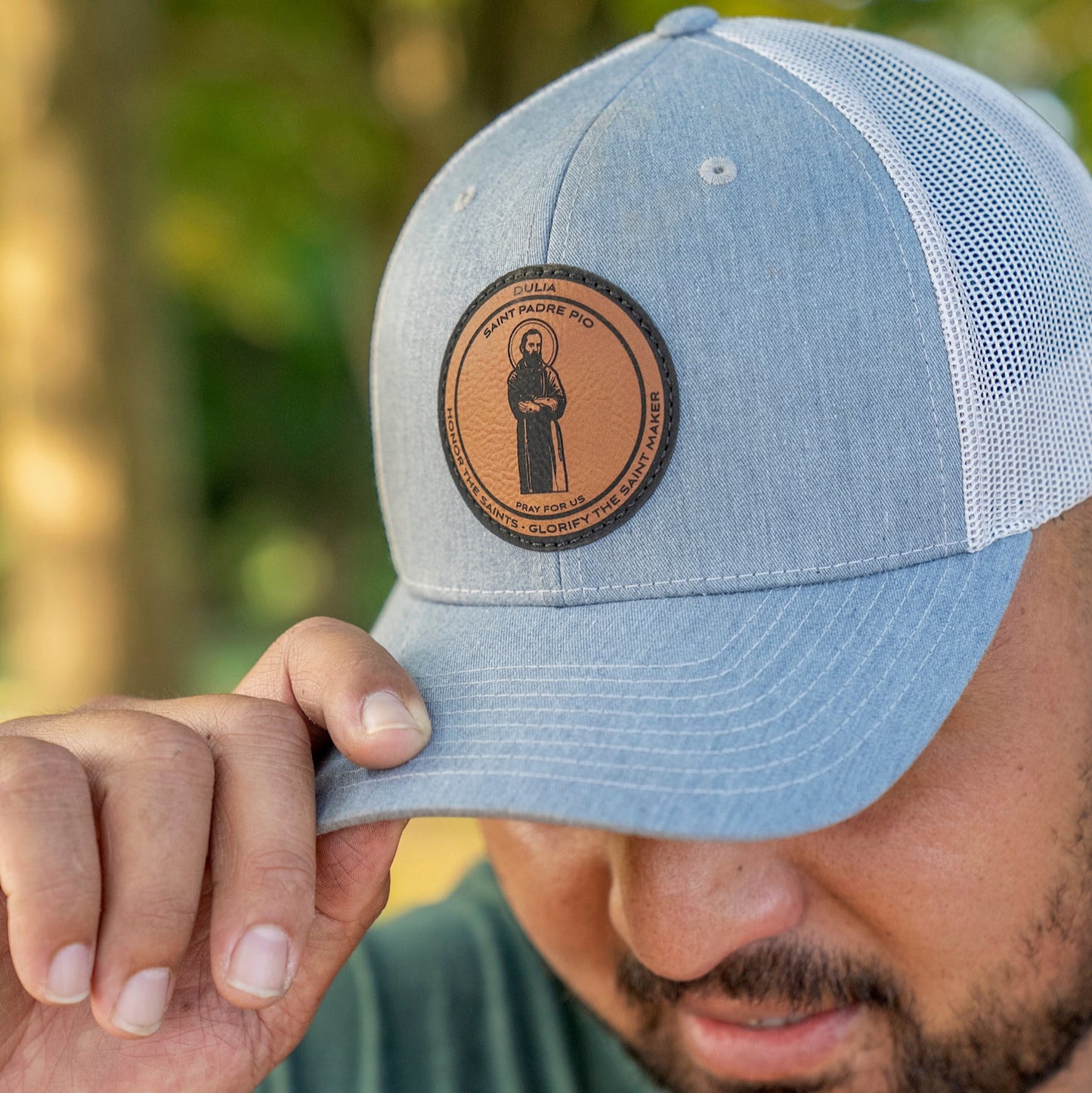 Leather patch trucker hat with St Padre Pio