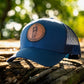 Leather patch trucker hat with St Joseph