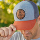 Leather patch trucker hat with St Juan Diego