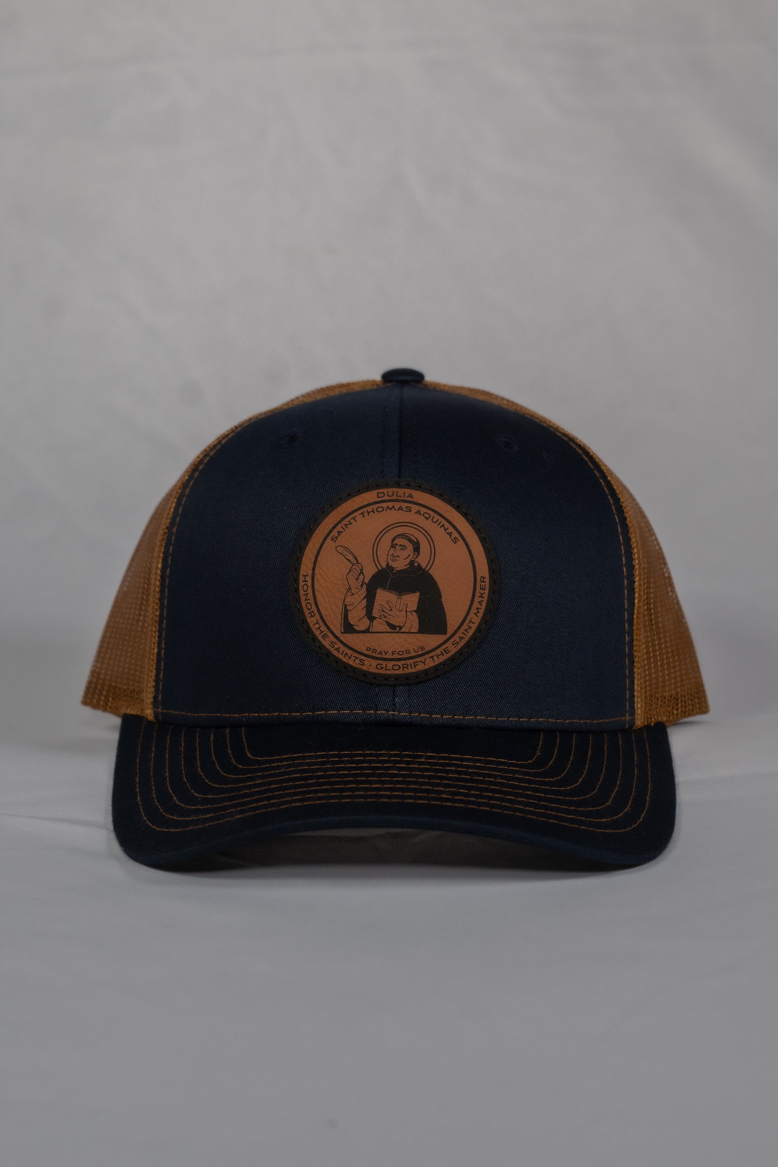 Leather patch trucker hat with St Thomas